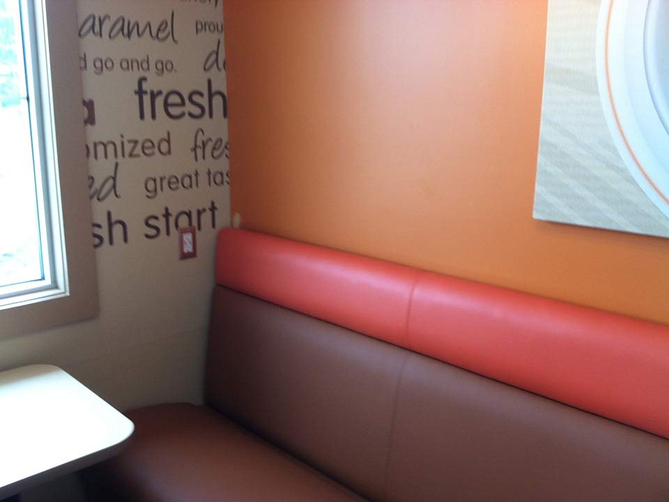Commercial café interior with fresh orange and cream walls