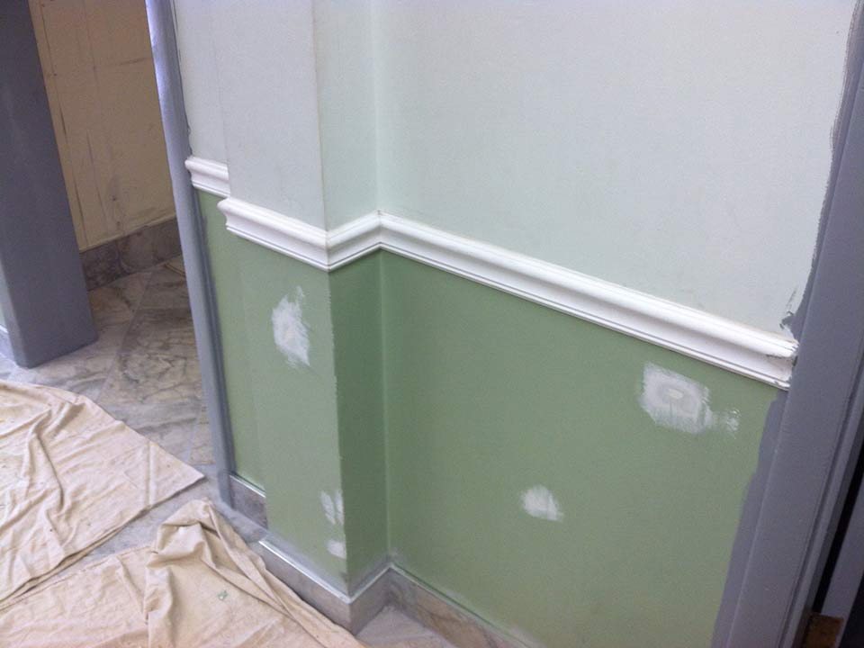 Room with drywall patched and spackled, ready for paint