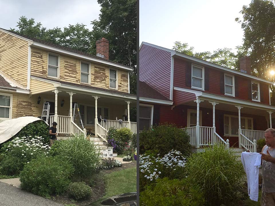 Deep red New England home after a full exterior repaint